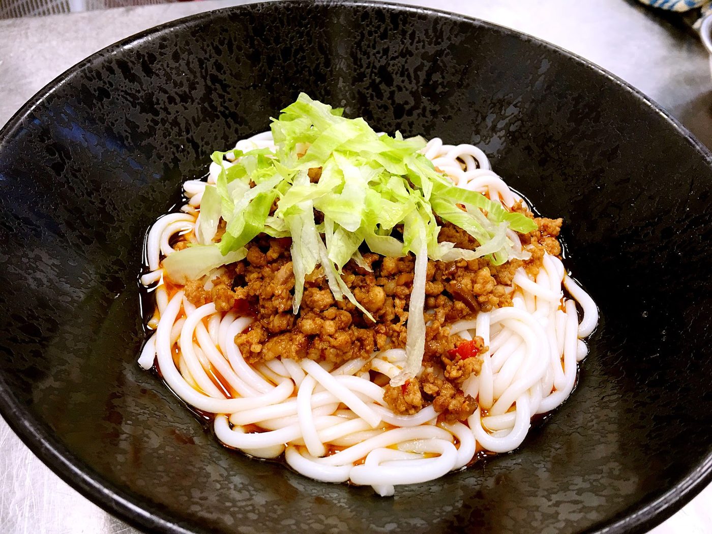 Bowl with noodles and a savoury topping
