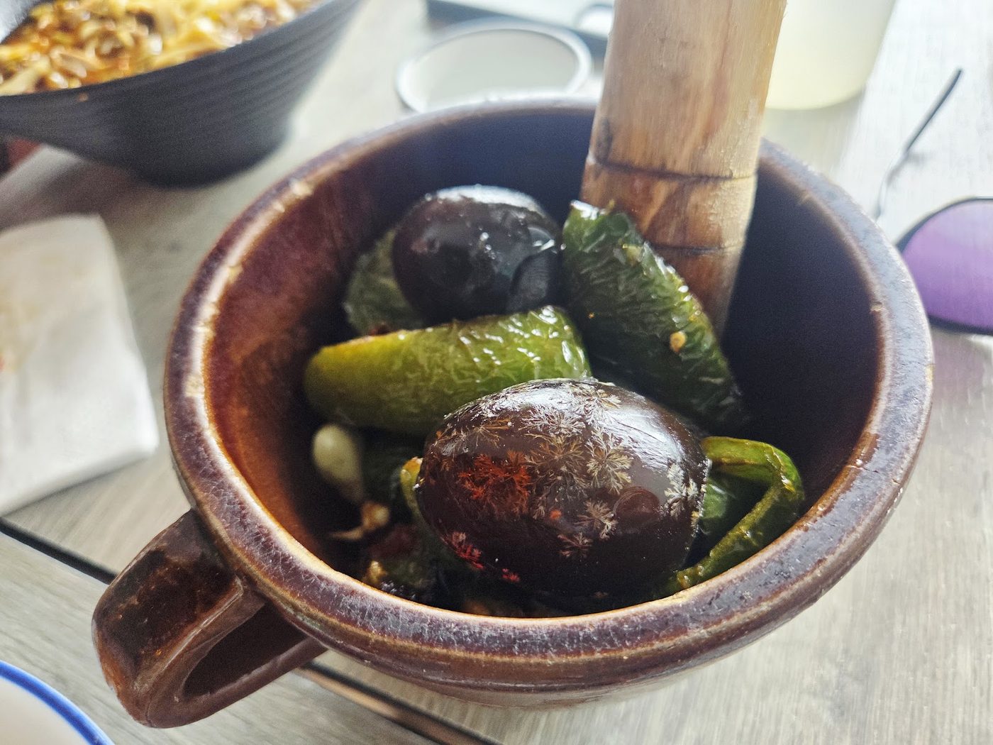 Small bowl of pickled and fresh side ingredients